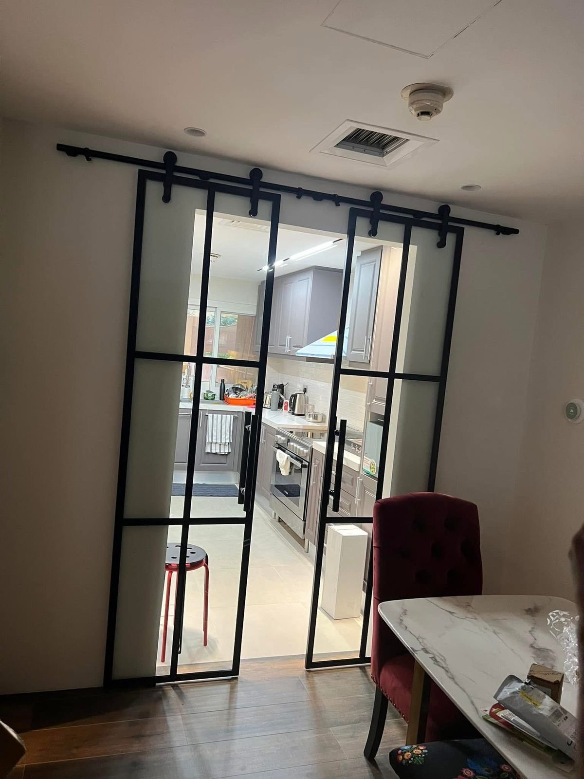 Black-Frame Sliding Kitchen Doors
