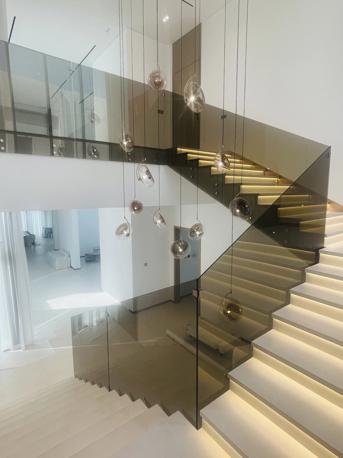 Illuminated glass staircase installation by Hasan Javed